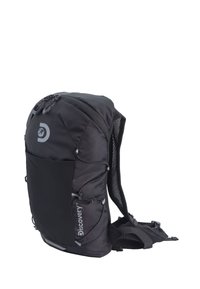 Black backpack with a textured finish, mesh side pocket, adjustable straps, and a top zipper closure. Features a logo and elastic cords.