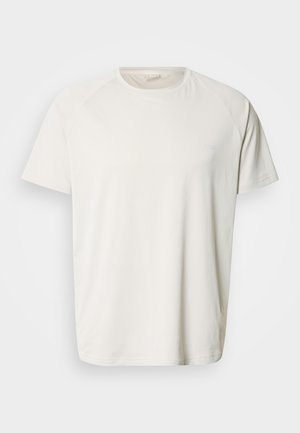 Világosbézs rövid ujjú póló texturált anyagból. Bordázott kerek nyakkivágással és egy kis logóval a mellkason.