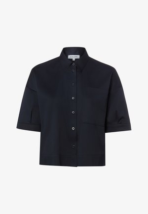 Schwarzes Kurzarm-Hemd mit Knöpfen, spitzem Kragen und einer einzelnen Brusttasche, innen am Kragen mit der Aufschrift "MORE & MORE".