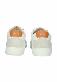 White sneakers with a smooth leather upper and light suede accents. Features an orange leather heel tab and white rubber sole.