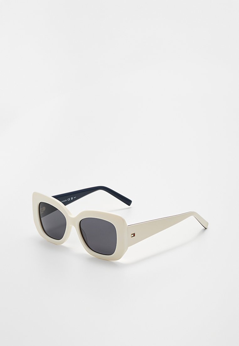 White oversized sunglasses with square lenses, dark gray tint. Features thick arms with subtle branding and a smooth matte texture.