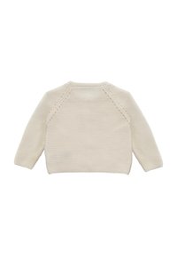 Suéter de punto en color crema con mangas largas, escote redondo y patrón de punto texturizado. Presenta mangas raglán y un corte relajado.