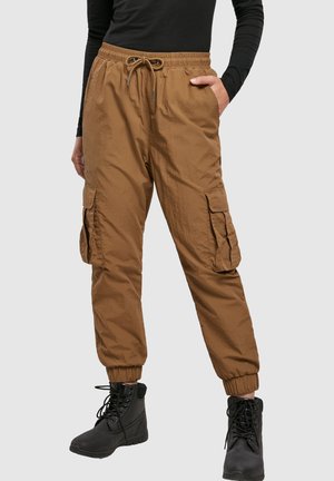 Brown cargo pants with an elastic waistband and drawstring. Features two side pockets and cargo pockets on each leg. Smooth, lightweight fabric.