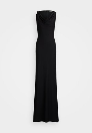 Robe noire mi-longue avec un col drapé, en tissu lisse, sans manches, et une fermeture éclair dissimulée à l'arrière. Silhouette simple et ajustée.