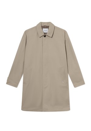 Beez värvi puuvillane sulekas, millel on nööbitav krae, pikad varrukad ja kaks külgmiste taskut. Üksikasjadega disain, kus ei ole nähtavaid mustreid ega aktsente.