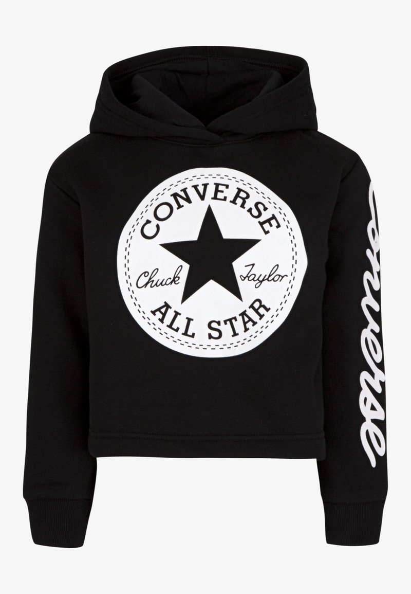 Sweat à capuche noir court en coton, présentant un grand logo circulaire blanc avec une étoile et le texte "Converse All Star", ainsi que des lettres blanches sur la manche.