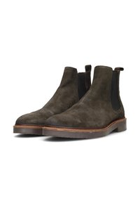 Botines de ante gris oscuro con paneles elásticos en los laterales, punteras redondeadas y suelas de cuero marrón con un borde cosido en contraste.