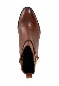 Bottine en cuir marron avec un bout pointu, une fermeture éclair sur le côté et une semelle texturée. Intérieur doublé en tissu, quincaillerie de la fermeture éclair en ton doré.