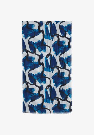 Strokes abstracte în albastru și bleumarin cu linii negre ondulate pe o țesătură dreptunghiulară albă, cu margini franjurate.