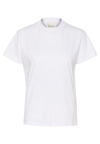 T-shirt bianca in cotone con scollatura rotonda, maniche corte e un sottile motivo a pois neri. L'etichetta interna riporta "IL MIO GUARDAROBA FONDAMENTALE."