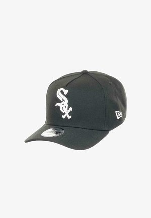 Black fitted baseball cap with a white stylized "S" logo on the front, featuring a curved brim and textured fabric.