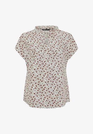 Biała bluzka z krótkim rękawem, w mały czerwony kwiatowy wzór, z dekoltem w kształcie łezki i falbaniastym wykończeniem kołnierza.