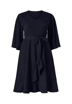 Black knee-length dress with V-neck, three-quarter sleeves, waist tie, and asymmetrical ruffle detail on the skirt.