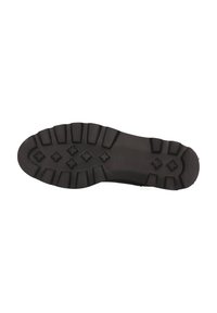 Suela de bota de goma negra con profundos relieves y empuñaduras en forma de cruz en el talón y en la parte delantera para tracción y durabilidad.