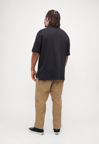 Tommy Hilfiger LIQUID ESSENTIAL  - Polo shirt - black