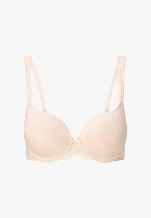 Reggiseno imbottito color pesca chiaro con rifiniture in pizzo al collo e alle spalline. Spalline regolabili e un piccolo fiocco decorativo al centro.