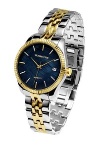 Reloj de acero inoxidable en tonos plateado y dorado con una esfera texturizada azul, acentos dorados, indicador de fecha y un diseño de pulsera de eslabones.