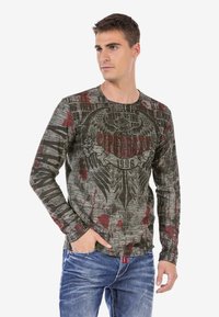 Langarm-Graphic-T-Shirt in Grau mit roten Akzenten. Mit einem Adlerdesign und verwitterten Textmustern. Hergestellt aus strukturiertem Stoff.