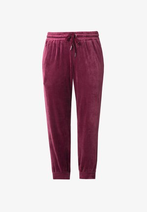Pantaloni jogger in velluto bordeaux con vita elastica, chiusura con coulisse e polsini aderenti. Texture liscia con una leggera lucentezza.