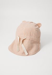 Striped bucket hat in peach and cream colors, featuring small ears, adjustable ties, and a soft fabric texture.