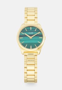 Gouden horloge met een turquoise gestreepte wijzerplaat, met een metalen afwerking en een schakelarmbandontwerp. Minimalistische uurmarkeringen en wijzers.