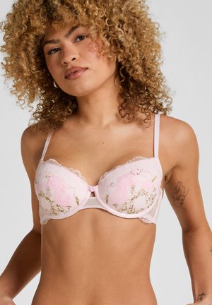 Roze kanten beha met geborduurde bloemen en gouden accenten, voorzien van beugelondersteuning en verstelbare bandjes. Fijne kanten rand langs de randen.