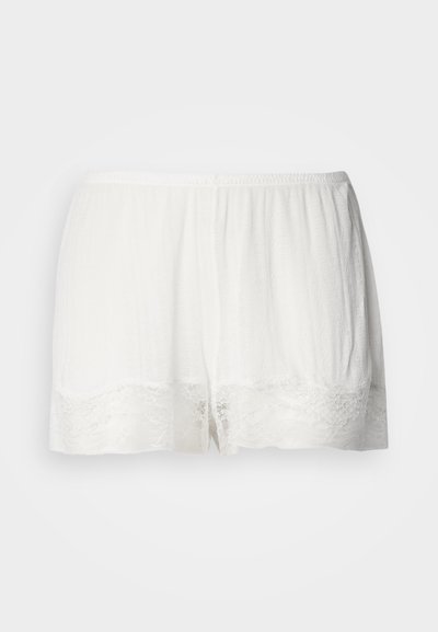Beli kratki hlače z čipkastim robom, narejene iz lahkega, polprosojnega materiala, s sproščenim krojem in elastičnim pasom za udobje.