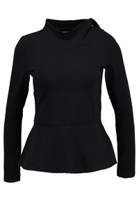 Schwarzes Langarmoberteil mit hochgeschlossenem Kragen und Peplum-Saum, aus weichem Stoff gefertigt. Mit einem Krawattenakzent an einer Schulter.