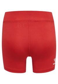 Pantaloni sportivi rossi con un design aderente, texture liscia e un logo sul lato destro in basso. Dettagli di cucitura minimi.