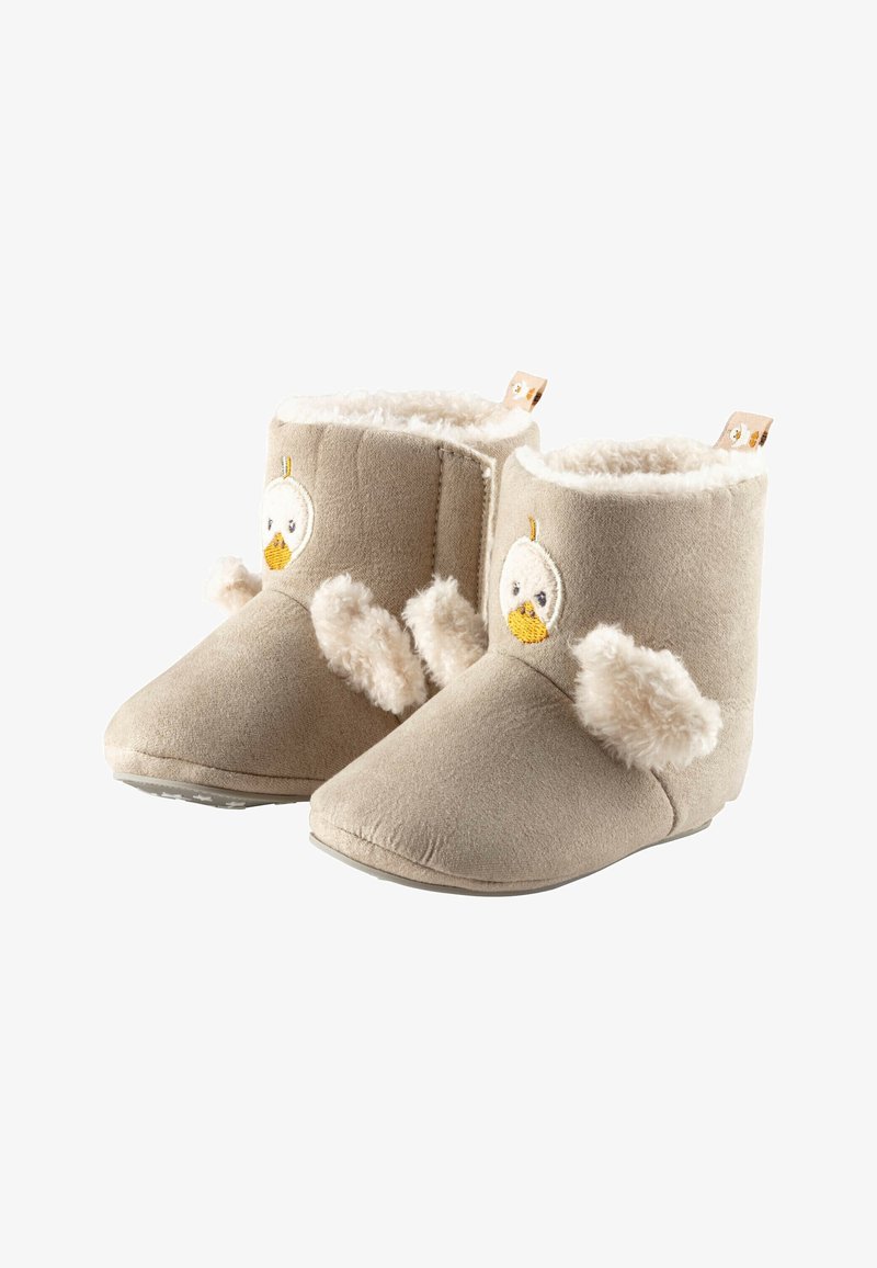 Bottes beige doux pour tout-petits avec doublure en peluche blanche, broderie de visage de canard sur le devant et détails d'ailes duveteuses sur les côtés.