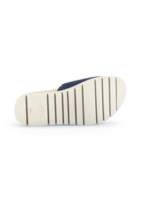 Shoe sole with a textured design in off-white rubber, featuring horizontal grooves and a branding imprint. No visible wear or damage.