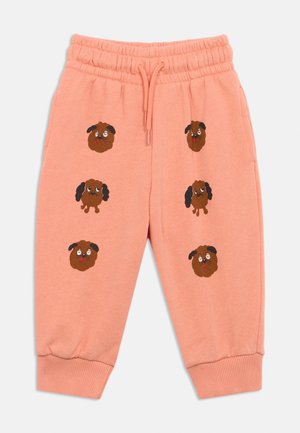 Pantaloni della tuta rosa con vita elastica. Presentano diversi volti di cani cartoon ricamati in marrone e nero. Orli alle caviglie a coste.