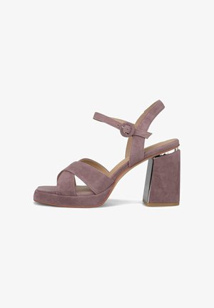 Sandale cu toc înalt din piele întoarsă mov pal, cu toc gros, curea cu cataramă la gleznă și barete încrucișate la deget, cu un detaliu metalic pe toc.