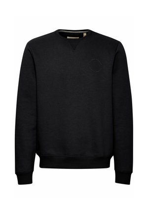 Felpa nera realizzata in tessuto testurizzato, con scollatura a girocollo, polsini a coste e un logo circolare sul petto. Design semplice e minimal.