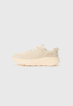 Beige Sportlich Schuhe mit einem strukturierten Strick-Obermaterial, dicker Zwischensohle und abgerundetem Zehenbereich. Mit schnürbarem Verschluss und dezenten Markenzeichen.