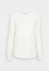 Sweatshirt blanc en maille côtelée avec manches longues, ourlet arrondi et encolure ronde. Texture douce et coupe décontractée. Aucun motif ou accent visible.