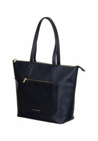 Sac cabas en cuir bleu marine avec double poignée, poche avant zippée et accents de fermeture éclair dorés, marqué "Betty Barclay" sur la poche avant.