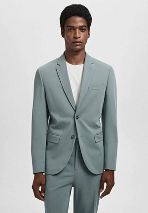 Helles tealfarbendes Anzug mit einer strukturierten Blazerjacke und passenden Hosen. Der Blazer hat einen Ein-Knopf-Verschluss, einen Reverskragen und Fronttaschen.