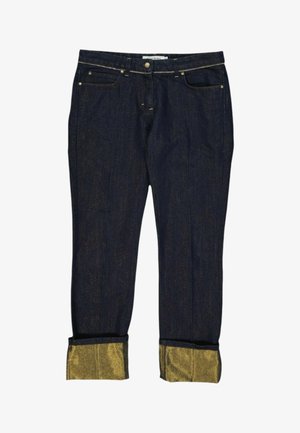 Jean en denim bleu foncé avec revers pliés montrant une doublure intérieure dorée scintillante, bouton avant et poches visibles sur fond blanc.