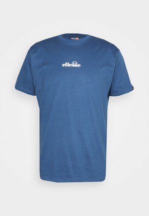 T-shirt en coton bleu à manches courtes, présentant un logo "ellesse" blanc sur la poitrine et sans motifs ni accents supplémentaires.