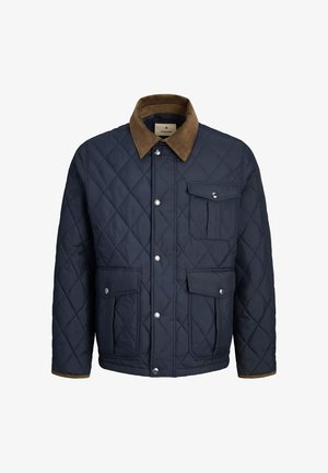 Chaqueta de marinero acolchada con cuello de pana marrón, botones a presión y tres bolsillos frontales con solapa.