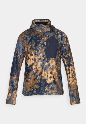 Long-sleeve fleece pullover with blue and brown mottled pattern, high neck, and navy zippered chest pocket.