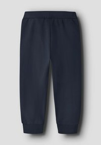 Granatowe spodnie dresowe wykonane z miękkiego materiału, z prążkowanym paskiem i mankietami, o luźnym kroju i bez widocznych wzorów.