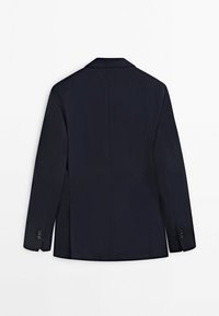 Blazer formel bleu marine foncé vu de dos, avec manches longues et détails de boutons aux poignets.