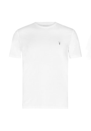 T-shirt bianca a maniche corte con scollo rotondo e piccolo logo ricamato nero a forma di testa di capra sul petto a sinistra.