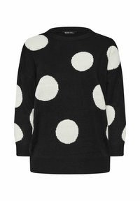 Svart stickad tröja med stora vita prickar, rund halsringning och trekvartslånga ärmar. Mjuk textur med ribbade mudd och nederkant.