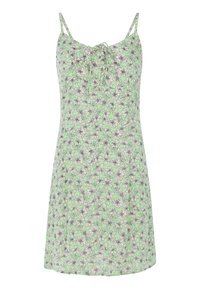 Lichtgroene mouwloze jurk met bloemenprint in zwart en wit. Voorzien van dunne bandjes en een strikdetail bij de halslijn. Glad textuur van de stof.