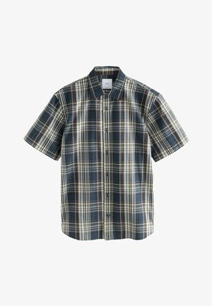 Košeľa s krátkym rukávom s kockovaným vzorom v hnedej, námorníckej modrej a krémovej farbe. Má zapínanie na gombíky a rozšírený golier, vyrobená z ľahkej látky s kockovaným vzorom.