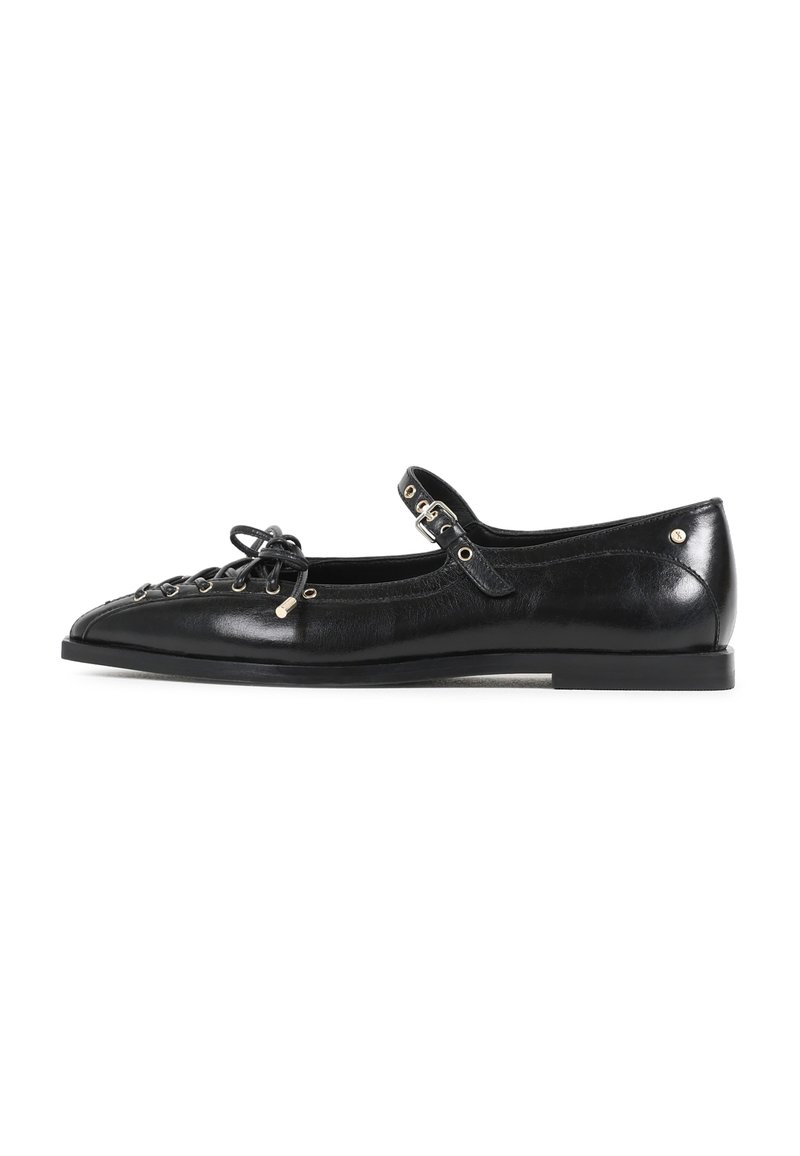 Black leather flat shoe with a pointed toe, featuring a lace-up front and side strap with metallic accents. Smooth, glossy texture.