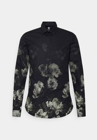 Zwarte langermige button-up shirt met een vervaagd wit rozenbloem patroon over de voorkant, mouwen en onderste zoom.